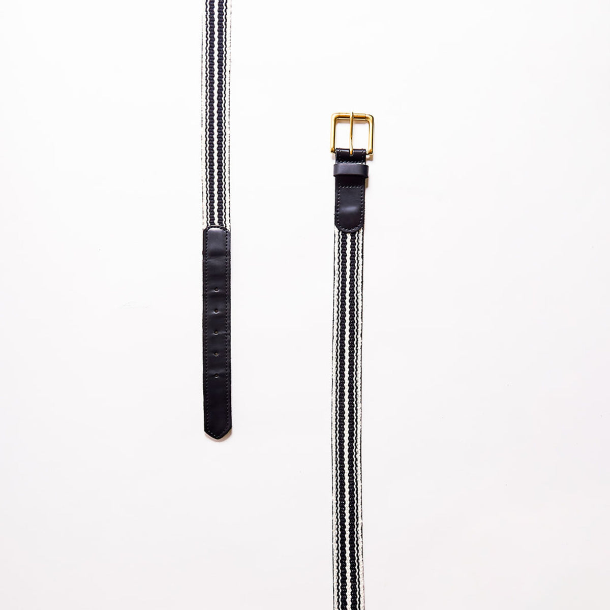 Black belt with gold buckle on a white background