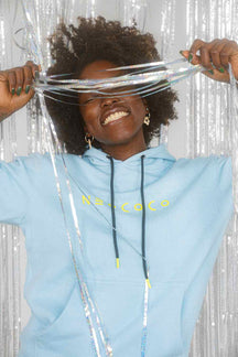 front view of model in powder blue fleece hoodie