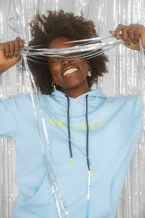 front view of model in powder blue fleece hoodie