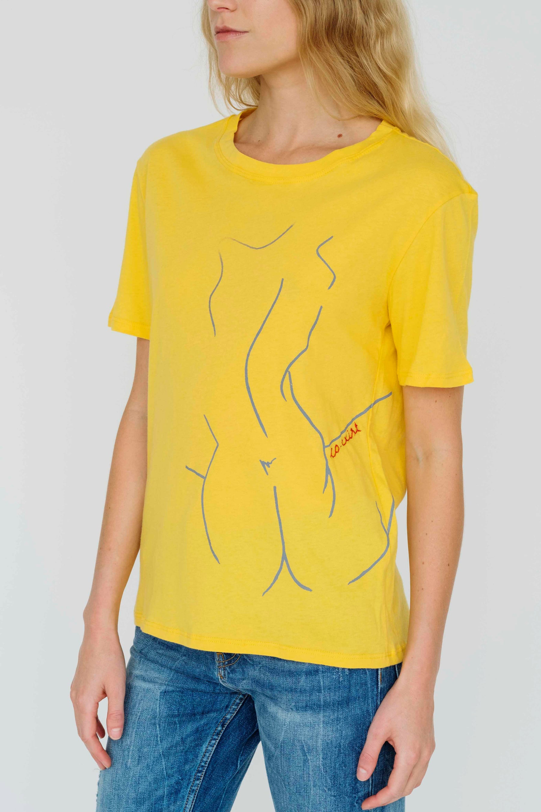 Empowering yellow t-shirt featuring woman silhouette embroidery