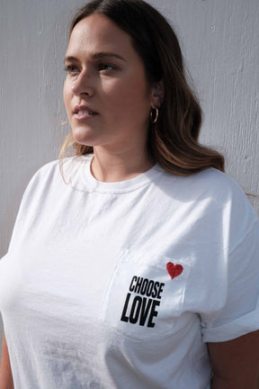 Close-up of hand embroidery on Choose Love t-shirt